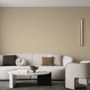 Dappled taupe wallpaper with reflective highlights, creating a warm and glamorous backdrop for contemporary interiors.
