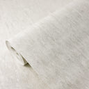 White vertical shimmer plaster texture wallpaper with subtle glittering effect, ideal for refined interior design. This hot embossed vinyl wallpaper enhances bedrooms and boutique spaces with its tactile yet understated elegance. A perfect choice for those seeking a luminous, sophisticated backdrop.