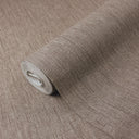 Brown vertical lines texture wallpaper with evenly spaced micro-striations on a warm brown ground. Faint pearlescent highlights within the ribbing add restrained shimmer to the matte finish, while the columnar rhythm visually elongates walls. Adhesive required.