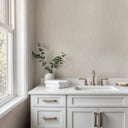 Raffia-inspired wallpaper in sandy beige with color variations, adding a touchable, organic feel to relaxed contemporary decor.
