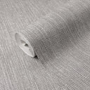 Gray raffia texture wallpaper with a pronounced square basket weave in warm mid-gray tones. The distinctly embossed surface forms shadowed recesses and raised strands that intensify in side light, bringing artisanal warmth to accent walls, lobbies and dining rooms. Adhesive required.