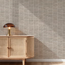 A medium-scale grasscloth pattern in sand beige with horizontal and vertical striations, offering a calm aesthetic for any interior. The eco-friendly, washable wallpaper is ideal for creating an accent wall in dining rooms or hospitality spaces. Made from high-quality materials, it requires wallpaper adhesive for application.