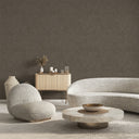 Brown shiny limewash wallpaper featuring a mottled, painterly surface with low-sheen accents. Perfect for creating a textured, natural atmosphere in feature walls or contemporary interiors. Available as traditional unpasted wallpaper.