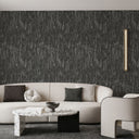 Close-up of dark gray wallpaper with fabric-like pile effect, adding depth and drama to intimate lounges or commercial spaces.