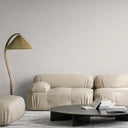 Warm off-white linen wallpaper with a fine fabric-like grain and delicate shadowing within the weave. The restrained, tactile texture melts into a smooth white plane from a distance. Requires adhesive application.
