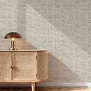 Close-up of beige grasscloth wallpaper featuring a woven basket effect, ideal for relaxed interiors with its organic texture.