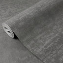 Dark gray limewash wallpaper with weathered effect and mottled brush marks, ideal for rustic or industrial loft-style interiors.