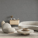 Gray shiny limewash wallpaper featuring directional trowel marks and random relief, providing a sculptural, metallic-tinged finish for modern interior design.