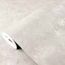 Shiny limewash texture wallpaper in pale white with brushy plaster marks. The subtle highlights create a soft, pearlescent finish ideal for feature walls or dining areas. Made in the USA with eco-friendly materials, this high-quality removable wallpaper adds an artisanal touch.