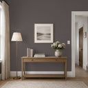 Linen texture wallpaper in smokey taupe, with warm brown and cool gray flecks creating a natural woven appearance. Ideal for sitting rooms or hospitality spaces, it provides a grounded, quiet texture. This eco-friendly wallpaper is strippable and requires adhesive.