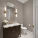 Beige limewash wallpaper with a subtle sheen combines taupe accents and reflective highlights. The varied texture with smooth and raised areas provides visual interest, ideal for accent walls in contemporary spaces. Adhesive required, perfect for adding a touch of elegance to transitional interiors.