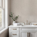 Close-up of beige wallpaper showcasing a linen-plaster hybrid with a pebble grain, perfect for elegant studies or hospitality spaces.