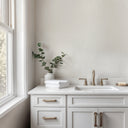 Close-up of white vertical shimmer plaster wallpaper showcasing delicate shimmer and light-catching particles. This medium-scale design adds a touch of elegance to bedrooms and reception areas, perfect for contemporary home decor with its subtle, refined texture.