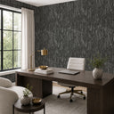 Moody charcoal wallpaper with strong depth and velvet-like texture, ideal for creating a bold statement in home or commercial interiors.