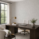 Pale gray wallpaper with a shimmering plaster-like texture, perfect for a contemporary accent wall in lounges or bedrooms.