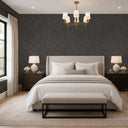 Granular dark gray wallpaper with mica flecks, offering a sleek, subtle shimmer suitable for feature walls in modern decor.