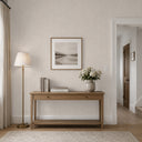 Beige wallpaper blending fabric-like weave with plaster overlay, offering a soft, tactile field for elegant home decor.