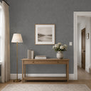 Gray shiny limewash texture wallpaper with a crystalline, sculptural plaster surface in deep charcoal tones. Pearlescent highlights on the raised relief contrast with matte recesses, creating a dramatic industrial finish for feature walls, restaurants and galleries. Adhesive required.