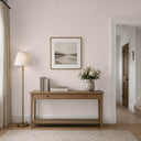 Close-up of taupe wallpaper with linen and plaster texture, providing intimate scale and soft character for interiors.