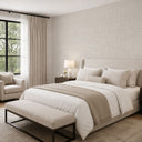 Ivory grasscloth texture wallpaper with faint linear striations and a matte surface, perfect for creating an intimate and textural feel in bedrooms or hospitality areas. The wallpaper's warm neutral tones blend seamlessly with various decor styles, offering a versatile design option.