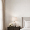 White linen plaster texture wallpaper featuring a fine woven textile appearance and matte finish. This eco-friendly removable wallpaper is ideal for creating a refined, subtle backdrop in bedrooms or office walls, offering a clean, neutral palette and gentle tactile finish.