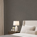 Limewash texture in charcoal gray with visual mottling, offering an aged plaster effect perfect for boutique retail or dining spaces.