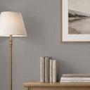 Close-up of ash gray wallpaper showcasing a tight crosshatch pattern, perfect for contemporary decor with its neutral palette and subtle tonal striations.