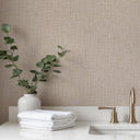Beige tweed-inspired wallpaper with a matte, finely textured surface offers a sophisticated look for libraries and offices. Its subtle linear grain and micro-flecking create a fabric-like impression, requiring wallpaper adhesive for application. Perfect for classic and refined interiors.