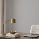 Vertical grain wallpaper with thin lighter wires in dark gray, offering a low-relief texture that evokes handwoven linen in minimalist interiors.