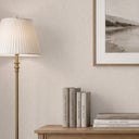Linen texture wallpaper in pale ivory-beige, featuring a uniform micro-weave that creates a fabric-like appearance. The matte finish catches light softly, making it ideal for rooms where a calm, refined atmosphere is desired. Perfect for decorators looking for high-quality materials.