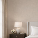 Close-up of dark beige linen-plaster wallpaper offering a gentle, sophisticated neutral that adds warmth to any room.