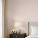Linen-plaster hybrid wallpaper in taupe, offering warm texture and subtle highlights for reading nooks or hospitality spaces.