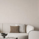Light beige wallpaper with vertical shimmer, offering a faint reflective quality for rooms needing gentle illumination and elegance.