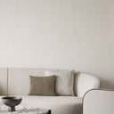 Vertical shimmer plaster wallpaper in white combines subtle texture with reflective particles, enhancing interiors with a sophisticated glow. Ideal for those seeking a modern, understated look in home decor, perfect for reception areas or any room needing an elevated touch.