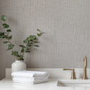 Sophisticated light gray tweed wallpaper featuring a compact stippled weave, ideal for modern, understated bedroom decor.