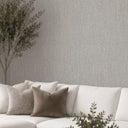 Gray raffia wallpaper featuring a pronounced basket weave effect with warm gray undertones, perfect for creating artisanal warmth in accent walls and dining areas.
