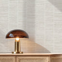 Ivory white wallpaper with a small-scale crosshatch weave and visible horizontal fiber lines. The organic grain and warm neutral tones make it suitable for study walls or hospitality interiors. This high-quality removable wallpaper is easy to apply and perfect for decorators seeking eco-friendly materials.