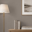 Close-up of blush beige linen texture wallpaper showing its matte finish and subtle textile appearance. A perfect choice for creating a quiet, refined base in intimate interiors like powder rooms, using removable peel and stick or traditional unpasted wallpaper.