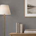 Subtle sage gray wallpaper with a linen-like crossweave, providing a soft fabric emulation. Perfect for living rooms desiring a restrained, natural look.