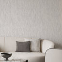 Light gray shimmer plaster wallpaper with soft directional streaks and a subtle sheen over the pale ground. Organic, non-geometric texture brings understated depth to modern interiors. Adhesive application required.