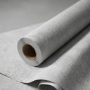 A close-up of a rolled sheet of light gray textured wallpaper, with the cardboard core visible and the surface showing a subtle embossed pattern.